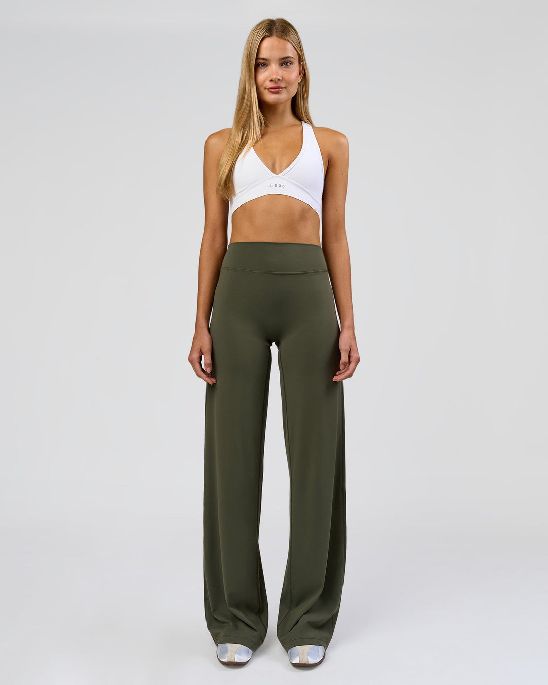 Woman wearing Elixir High-Rise Tall Pant - Pure Olive | Model:Taneisha | Size:XS - view 1