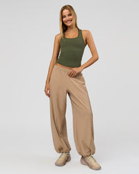 Woman wearing Flow Rib Scoop Neck Tank - Pure Olive | Model:Taneisha | Size:XS | Thumbnail Index: 9
