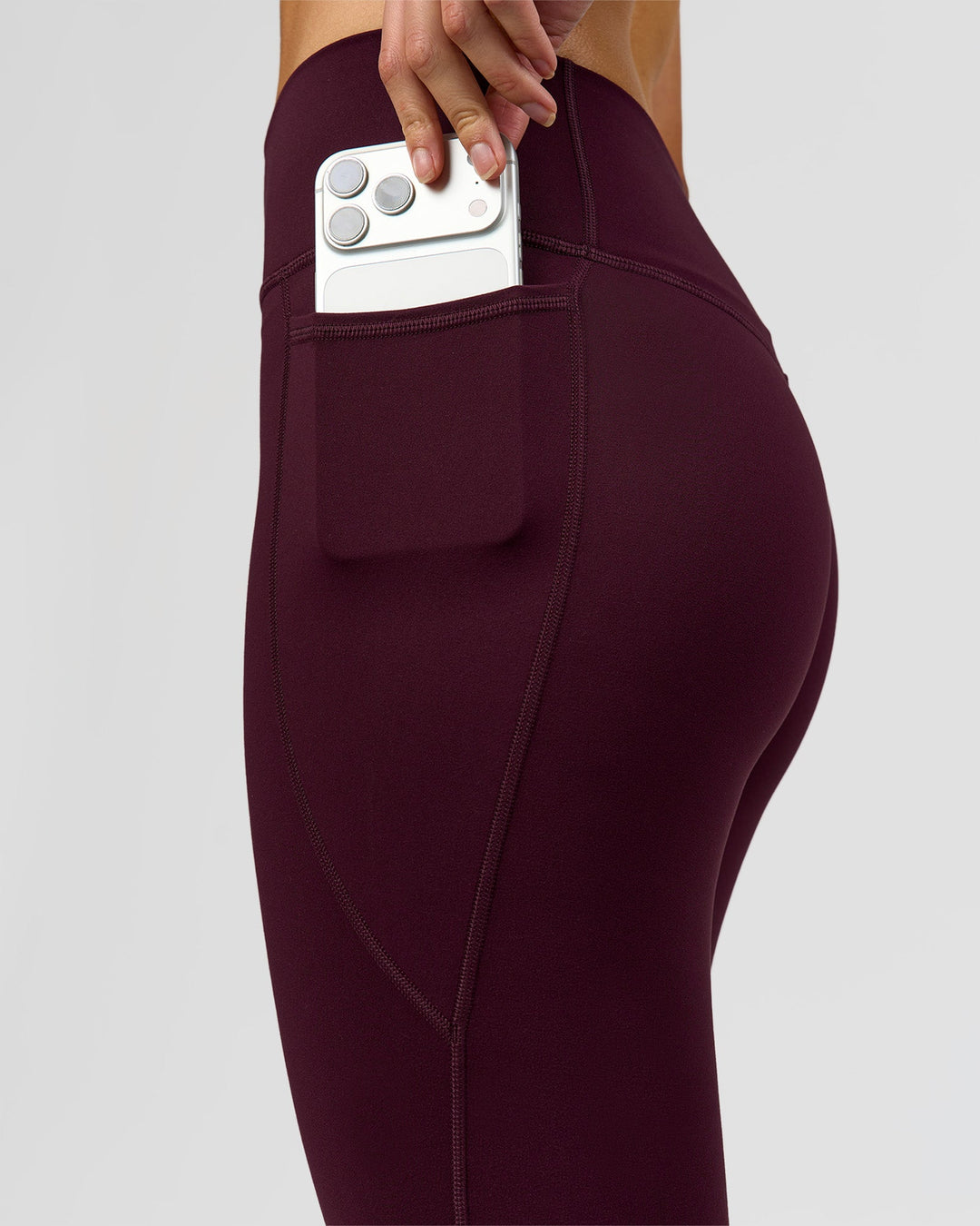 Woman wearing Fusion High-Rise 7/8 Legging Pockets - Cherry Lacquer | Model:Taneisha | Size:XS - view 5