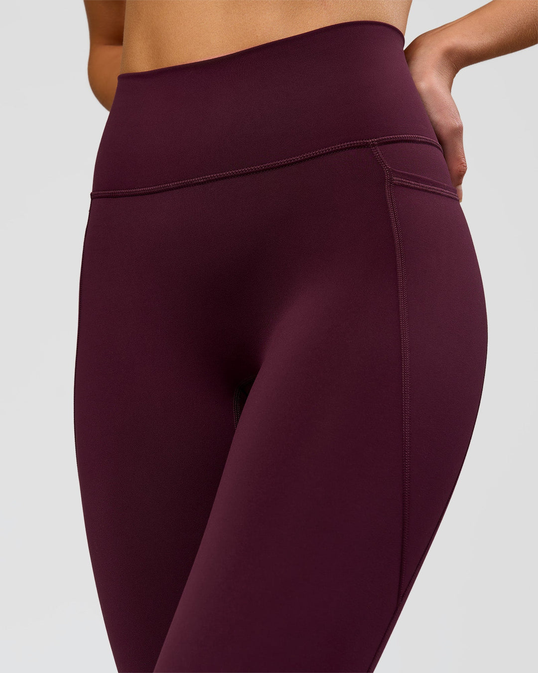 Woman wearing Fusion Ultra High-Rise 3/4 Legging Pockets - Cherry Lacquer | Model:Taneisha | Size:XS - view 3