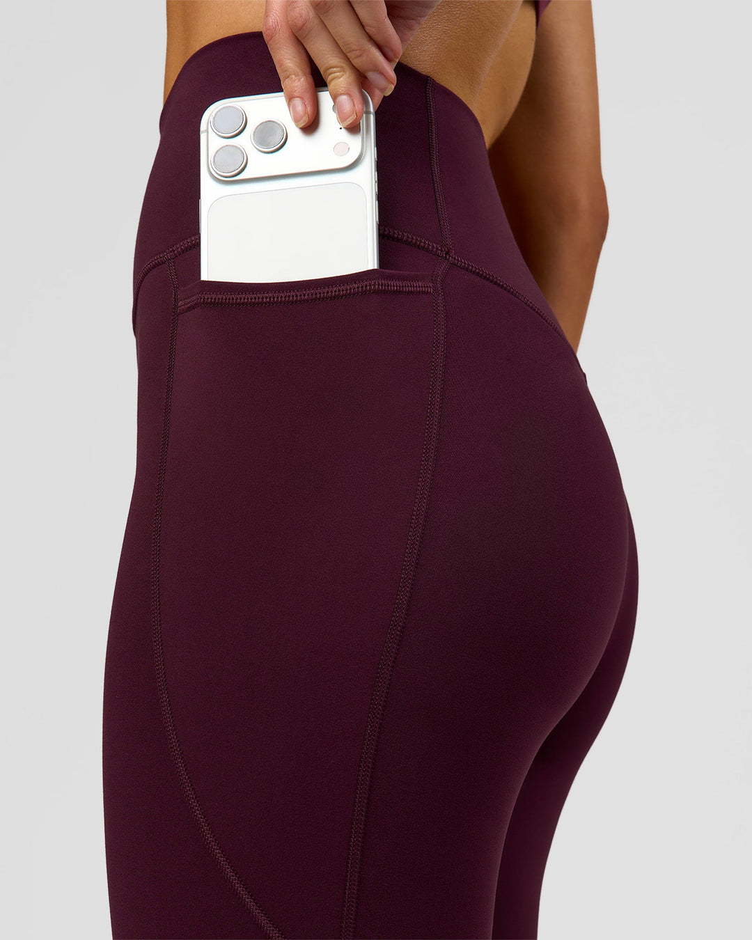 Woman wearing Fusion Ultra High-Rise 3/4 Legging Pockets - Cherry Lacquer | Model:Taneisha | Size:XS - view 4