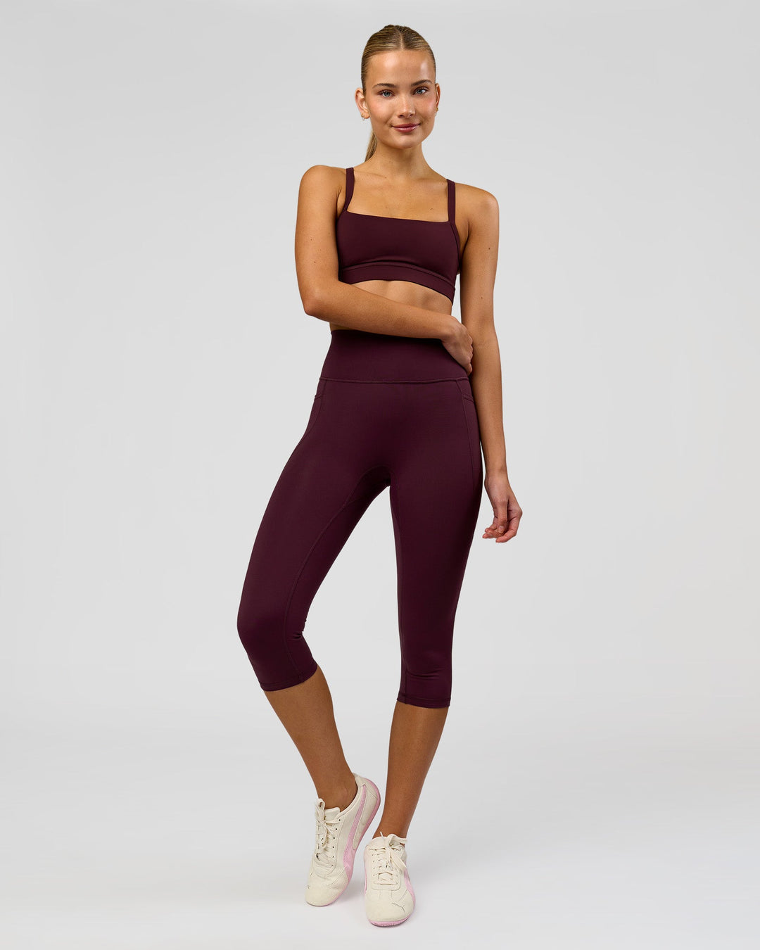 Woman wearing Fusion Ultra High-Rise 3/4 Legging Pockets - Cherry Lacquer | Model:Taneisha | Size:XS - view 5