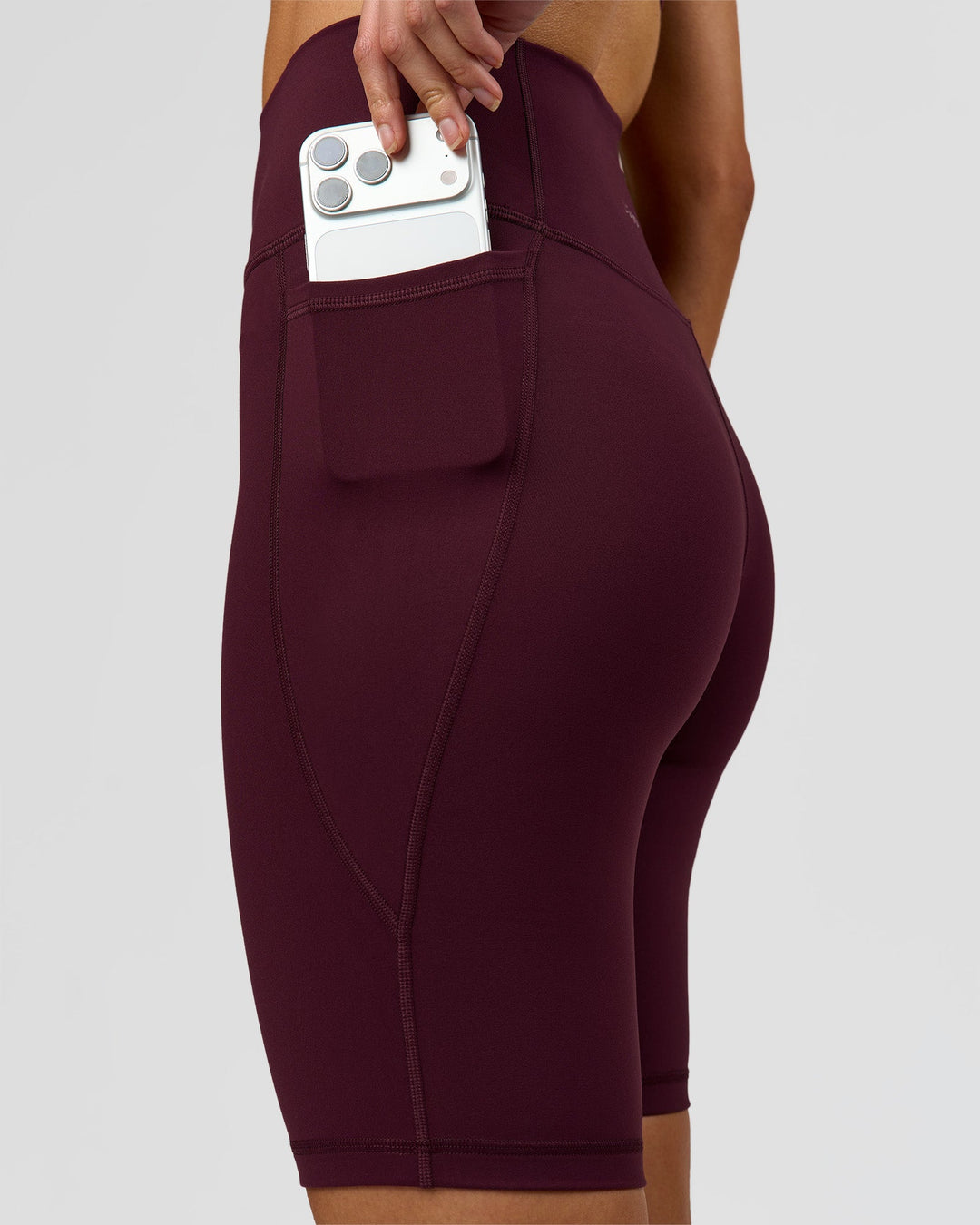 Woman wearing Fusion Ultra High-Rise 9" Short Pockets - Cherry Lacquer | Model:Taneisha | Size:XS - view 6