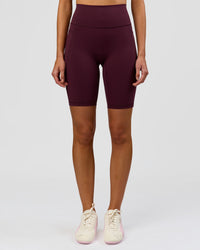 Woman wearing Fusion Ultra High-Rise 9" Short Pockets - Cherry Lacquer | Model:Taneisha | Size:XS | Thumbnail Index: 1
