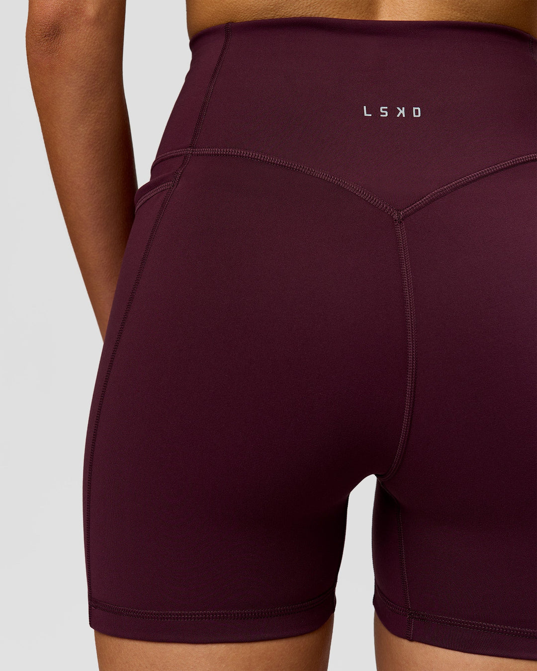 Woman wearing Fusion V-Contour Ultra High-Rise 4" Short Pockets - Cherry Lacquer | Model:Taneisha | Size:XS - view 4