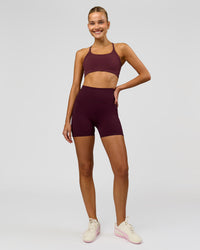 Woman wearing Fusion V-Contour Ultra High-Rise 4" Short Pockets - Cherry Lacquer | Model:Taneisha | Size:XS | Thumbnail Index: 4