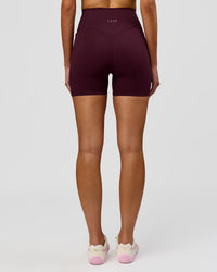Woman wearing Fusion V-Contour Ultra High-Rise 4" Short Pockets - Cherry Lacquer | Model:Taneisha | Size:XS | Thumbnail Index: 10