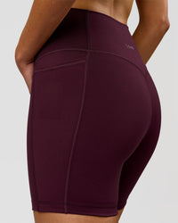 Woman wearing Fusion V-Contour Ultra High-Rise 6" Short Pockets - Cherry Lacquer | Model:Taneisha | Size:XS | Thumbnail Index: 6