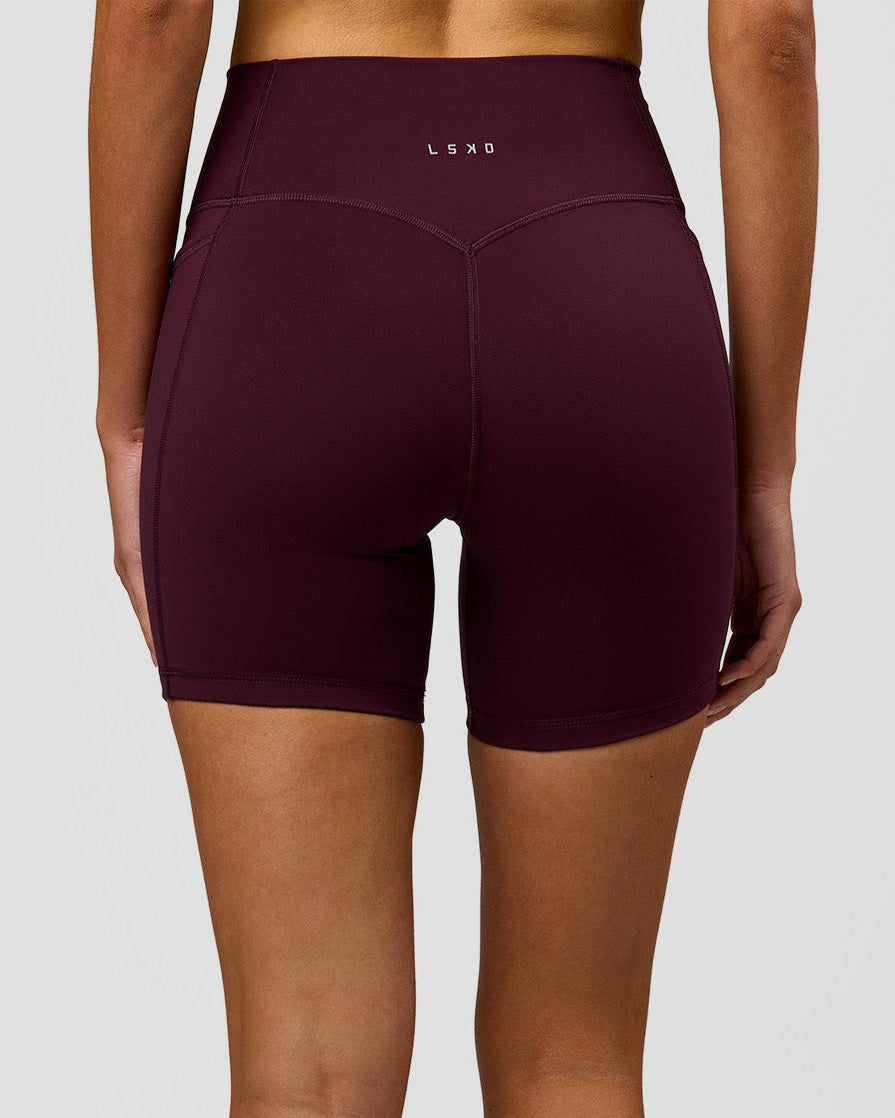 Woman wearing Fusion V-Contour Ultra High-Rise 6" Short Pockets - Cherry Lacquer | Model:Taneisha | Size:XS - view 2