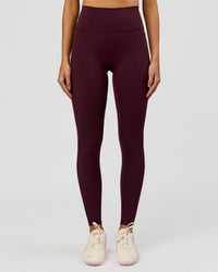 Woman wearing Fusion V-Contour Ultra High-Rise Full Length Legging Pockets - Cherry Lacquer | Model:Taneisha | Size:XS | Thumbnail Index: 1