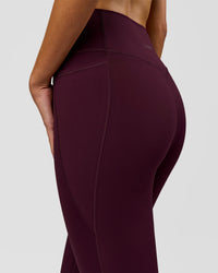 Woman wearing Fusion V-Contour Ultra High-Rise Full Length Legging Pockets - Cherry Lacquer | Model:Taneisha | Size:XS | Thumbnail Index: 7