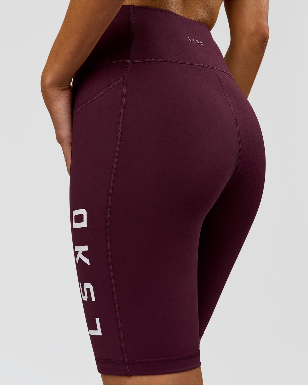 Woman wearing Rep Ultra High-Rise 9" Short Pockets - Cherry Lacquer-White | Model:Taneisha | Size:XS - view 7