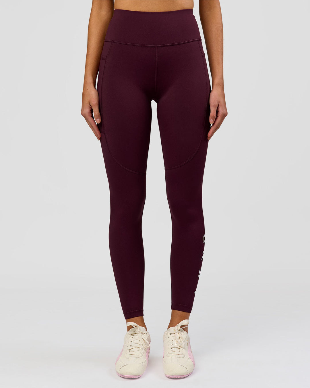 Woman wearing Rep Ultra High-Rise Full Length Legging Pockets - Cherry Lacquer-White | Model:Taneisha | Size:XS - view 3