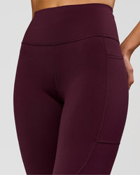 Woman wearing Rep Ultra High-Rise Full Length Legging Pockets - Cherry Lacquer-White | Model:Taneisha | Size:XS | Thumbnail Index: 4