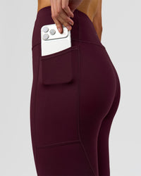 Woman wearing Rep Ultra High-Rise Full Length Legging Pockets - Cherry Lacquer-White | Model:Taneisha | Size:XS | Thumbnail Index: 5