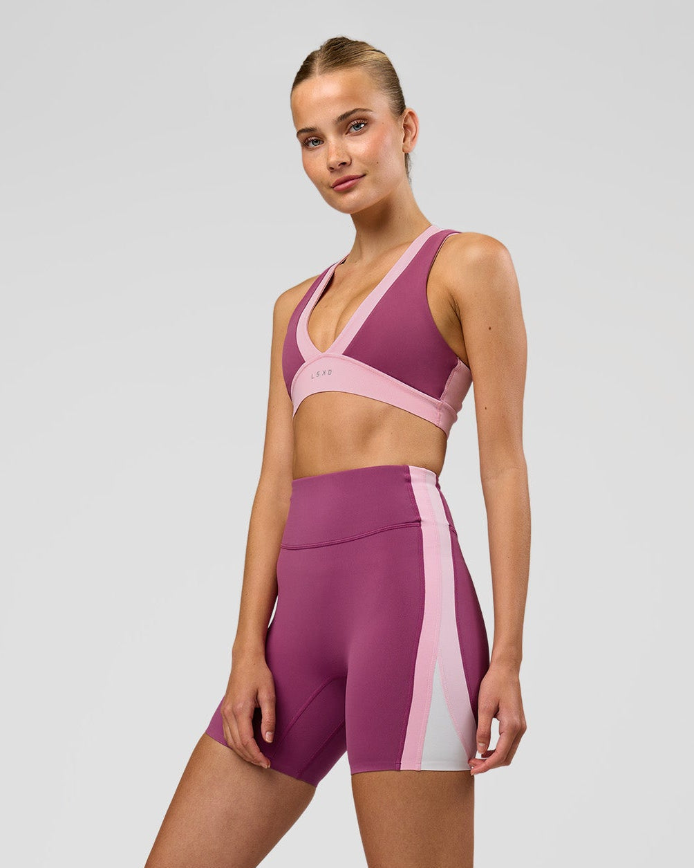 Woman wearing Revitalise Ultra High-Rise 6" Short - Boysenberry-Pink Rose | Model:Taneisha | Size:XS - view 2