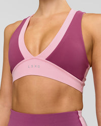 Woman wearing Stamina Layered Sports Bra - Boysenberry-Pink Rose | Model:Taneisha | Size:XS | Thumbnail Index: 1