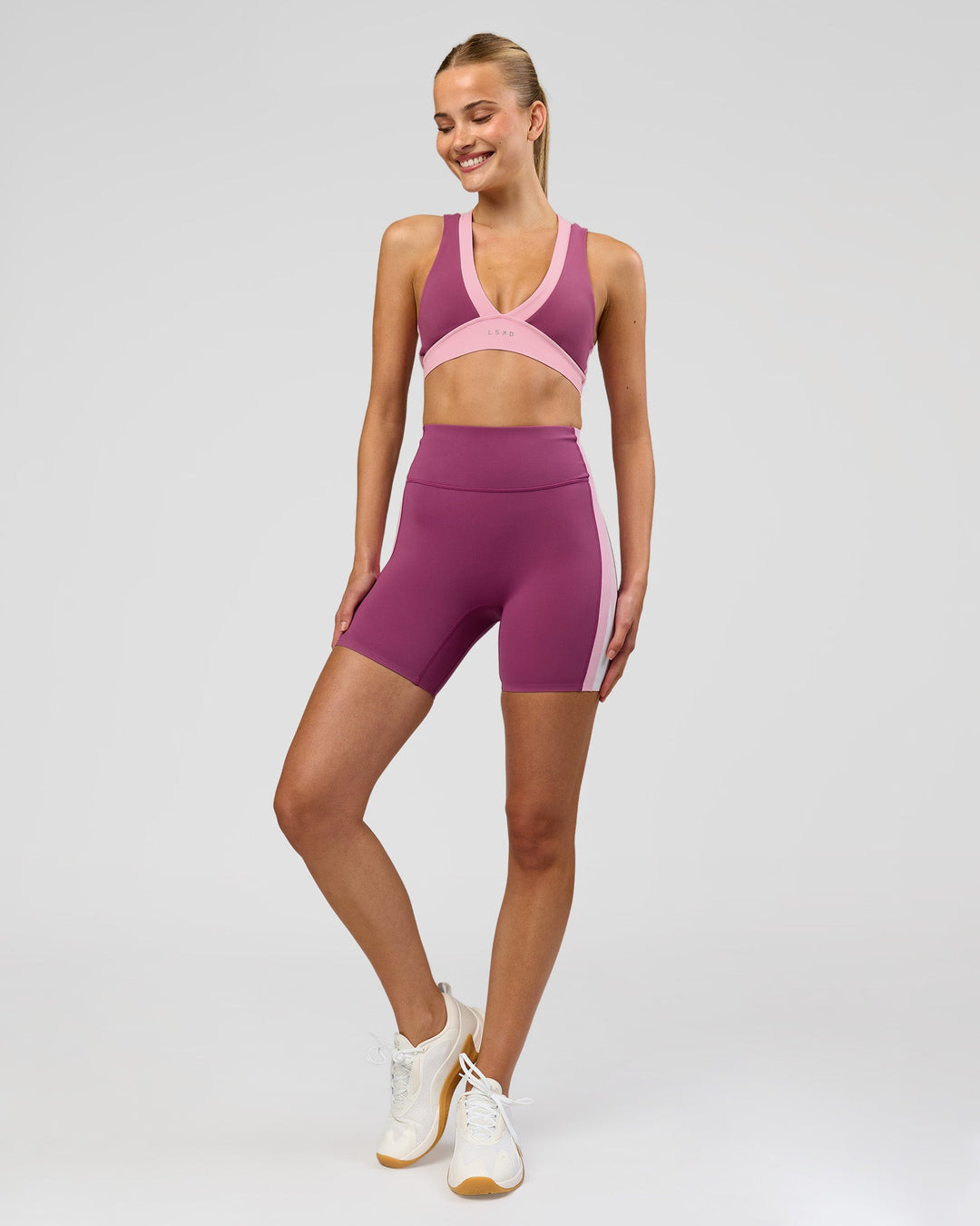 Woman wearing Stamina Layered Sports Bra - Boysenberry-Pink Rose | Model:Taneisha | Size:XS - view 7