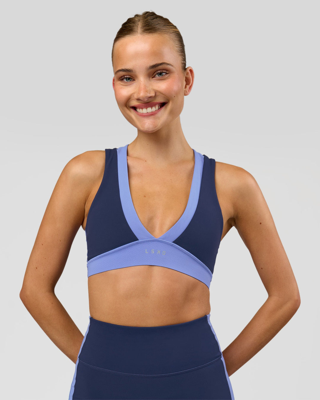 Woman wearing Stamina Layered Sports Bra - Future Navy-Bluebell | Model:Taneisha | Size:XS - view 6