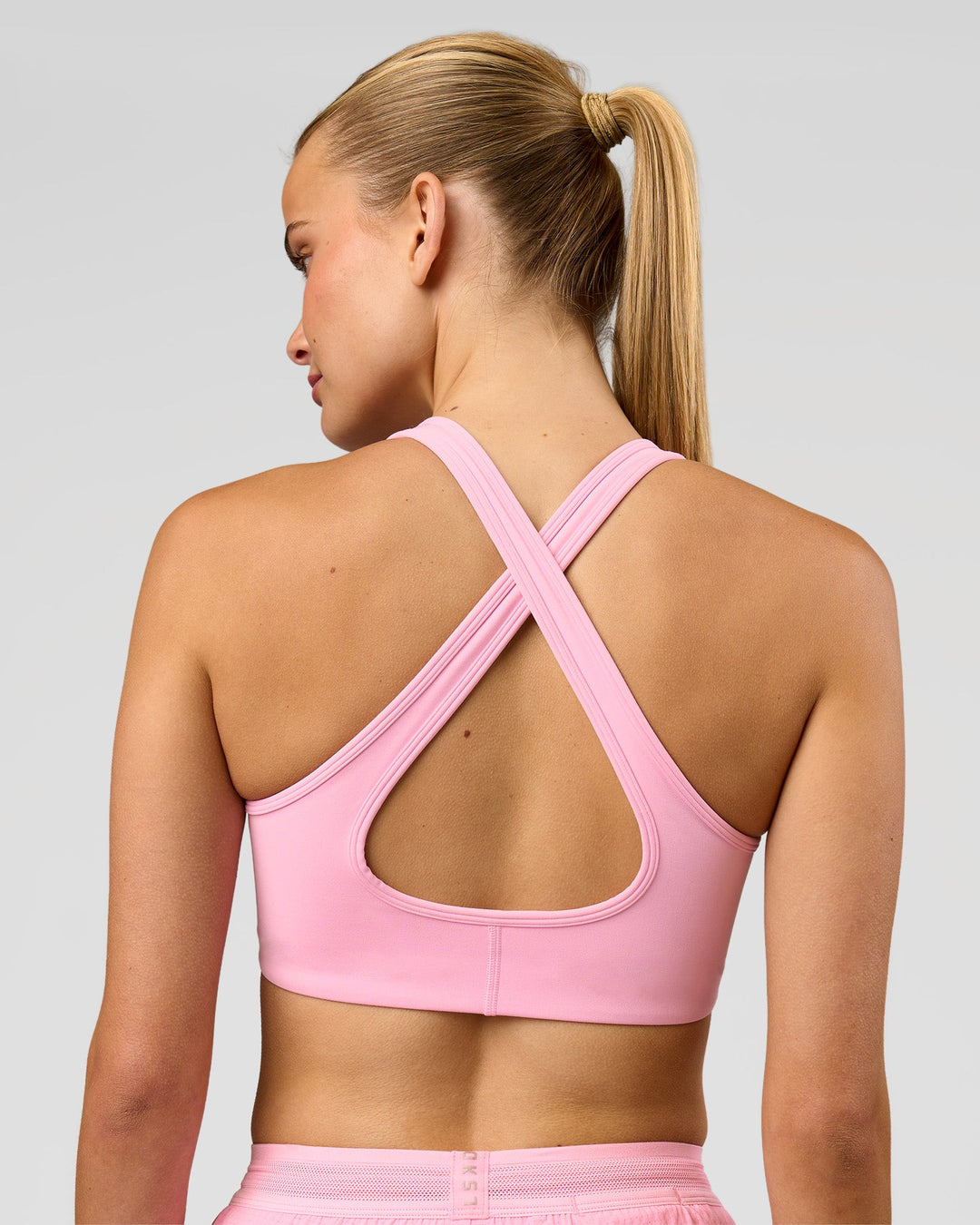 Woman wearing Stamina Sports Bra - Pink Rose | Model:Taneisha | Size:XS - view 2