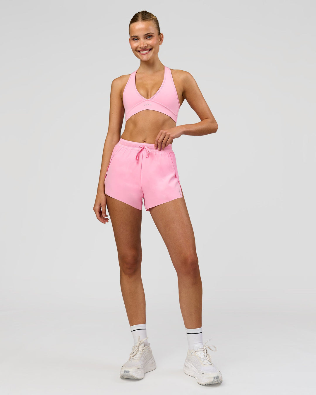Woman wearing Stamina Sports Bra - Pink Rose | Model:Taneisha | Size:XS