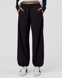 Woman wearing Stitch Up Track Pant - Black | Model:Taneisha | Size:XS | Thumbnail Index: 3