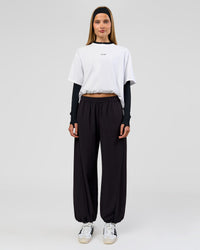 Woman wearing Stitch Up Track Pant - Black | Model:Taneisha | Size:XS | Thumbnail Index: 5