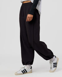 Woman wearing Stitch Up Track Pant - Black | Model:Taneisha | Size:XS | Thumbnail Index: 0