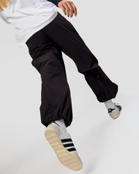 Woman wearing Stitch Up Track Pant - Black | Model:Taneisha | Size:XS | Thumbnail Index: 7
