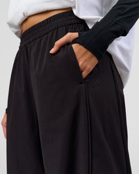 Woman wearing Stitch Up Track Pant - Black | Model:Taneisha | Size:XS | Thumbnail Index: 10