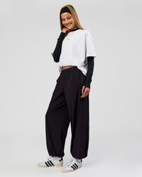 Woman wearing Stitch Up Track Pant - Black | Model:Taneisha | Size:XS | Thumbnail Index: 11