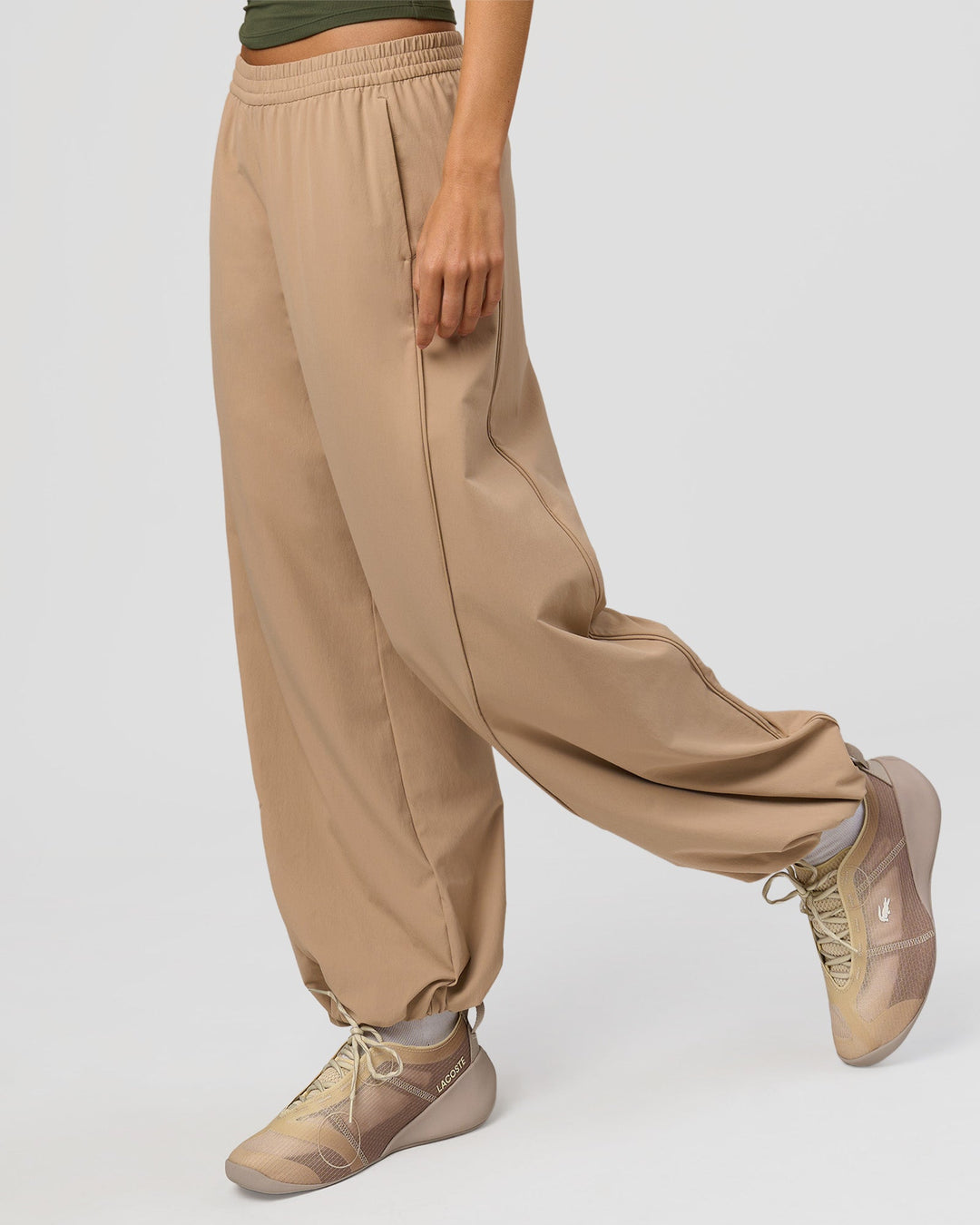 Woman wearing Stitch Up Track Pant - Warm Smoke | Model:Taneisha | Size:XS - view 1