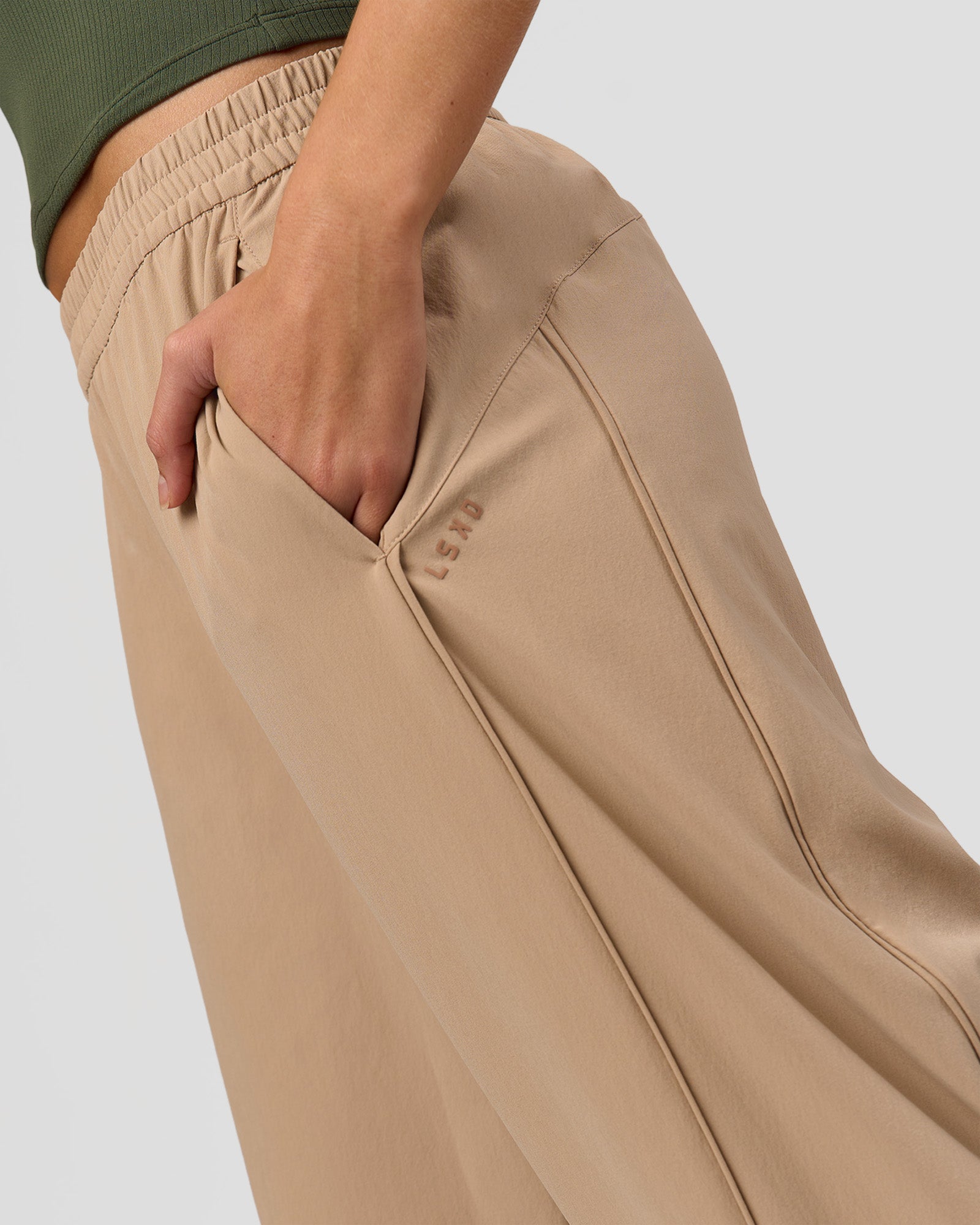 Woman wearing Stitch Up Track Pant - Warm Smoke | Model:Taneisha | Size:XS