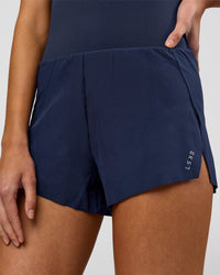 Woman wearing Tia-Clair Toomey-Orr Legacy 3" Run One-Piece - Future Navy | Model:Taneisha | Size:XS | Thumbnail Index: 13