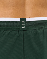 Woman wearing Trackline Accelerate 3" High-Rise Running Short - Midnight Green-White | Model:Taneisha | Size:XS | Thumbnail Index: 13