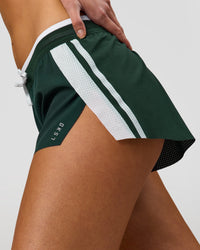 Woman wearing Trackline Accelerate 3" Mid Rise Running Short - Midnight Green-White | Model:Taneisha | Size:XS | Thumbnail Index: 2