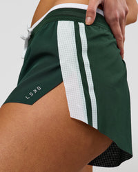 Woman wearing Trackline Accelerate 3" Mid Rise Running Short - Midnight Green-White | Model:Taneisha | Size:XS | Thumbnail Index: 6