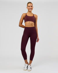 Woman wearing Twist Sports Bra - Cherry Lacquer | Model:Taneisha | Size:XS | Thumbnail Index: 2