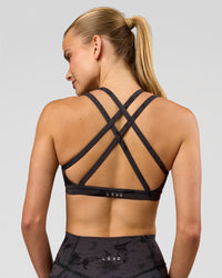 Woman wearing Velocity Sports Bra - Black Tie Dye | Model:Taneisha | Size:XS | Thumbnail Index: 0