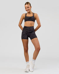 Woman wearing Velocity Sports Bra - Black Tie Dye | Model:Taneisha | Size:XS | Thumbnail Index: 2