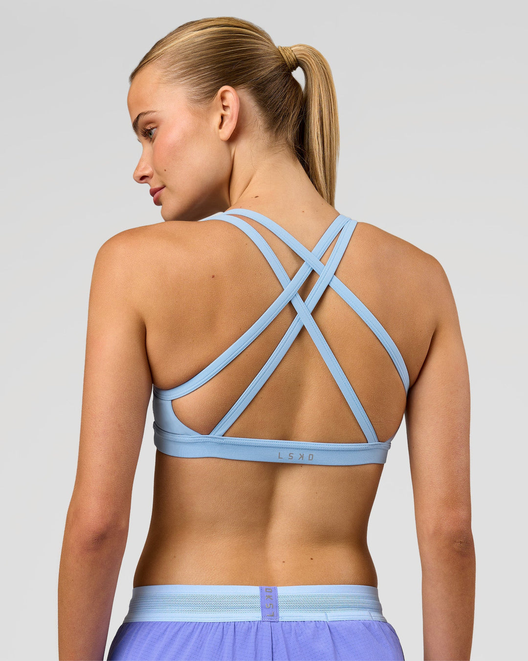 Woman wearing Velocity Sports Bra - Open Air | Model:Taneisha | Size:XS - view 1