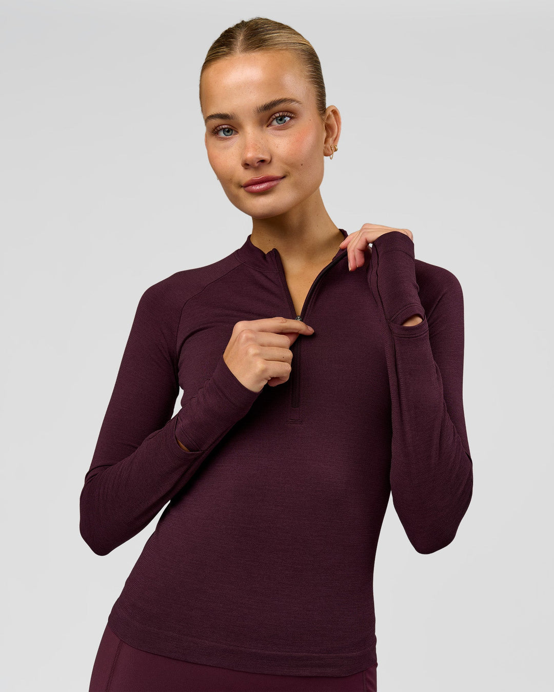 Woman wearing AeroFLX+ Long Sleeve Half Zip - Cherry Lacquer/Cherry Laquer | Model:Taniesha | Size:XS - view 1
