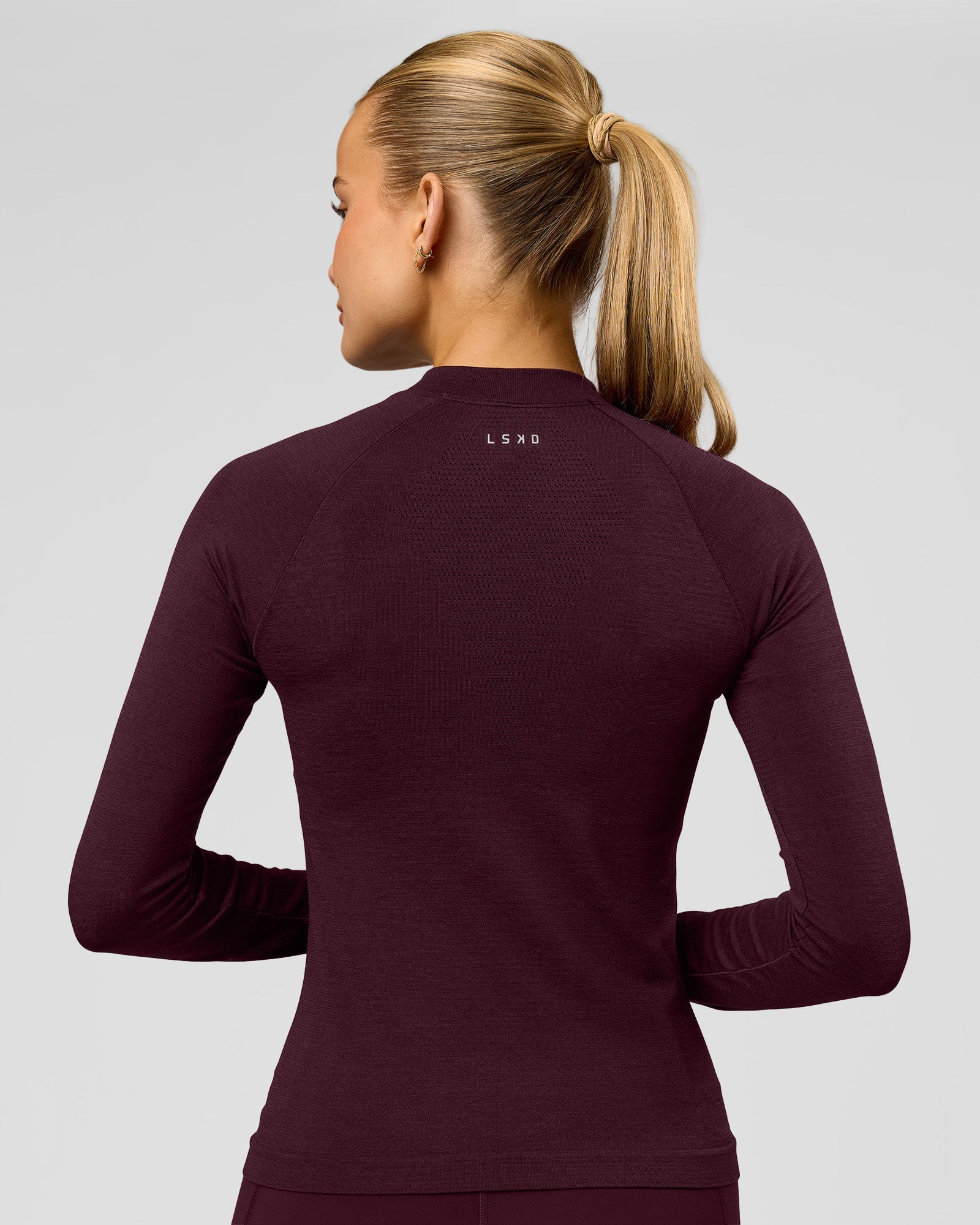Woman wearing AeroFLX+ Long Sleeve Half Zip - Cherry Lacquer/Cherry Laquer | Model:Taniesha | Size:XS