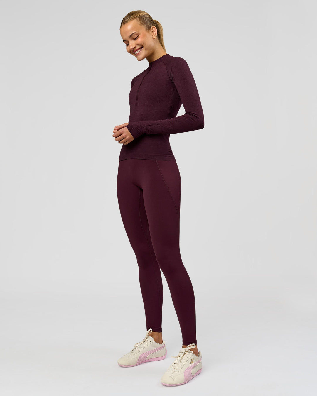 Woman wearing AeroFLX+ Long Sleeve Half Zip - Cherry Lacquer/Cherry Laquer | Model:Taniesha | Size:XS - view 4