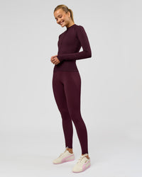Woman wearing AeroFLX+ Long Sleeve Half Zip - Cherry Lacquer/Cherry Laquer | Model:Taniesha | Size:XS | Thumbnail Index: 3