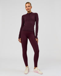 Woman wearing AeroFLX+ Long Sleeve Half Zip - Cherry Lacquer/Cherry Laquer | Model:Taniesha | Size:XS | Thumbnail Index: 8