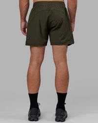 Man wearing Challenger 6" Lined Performance Short - Forest Night