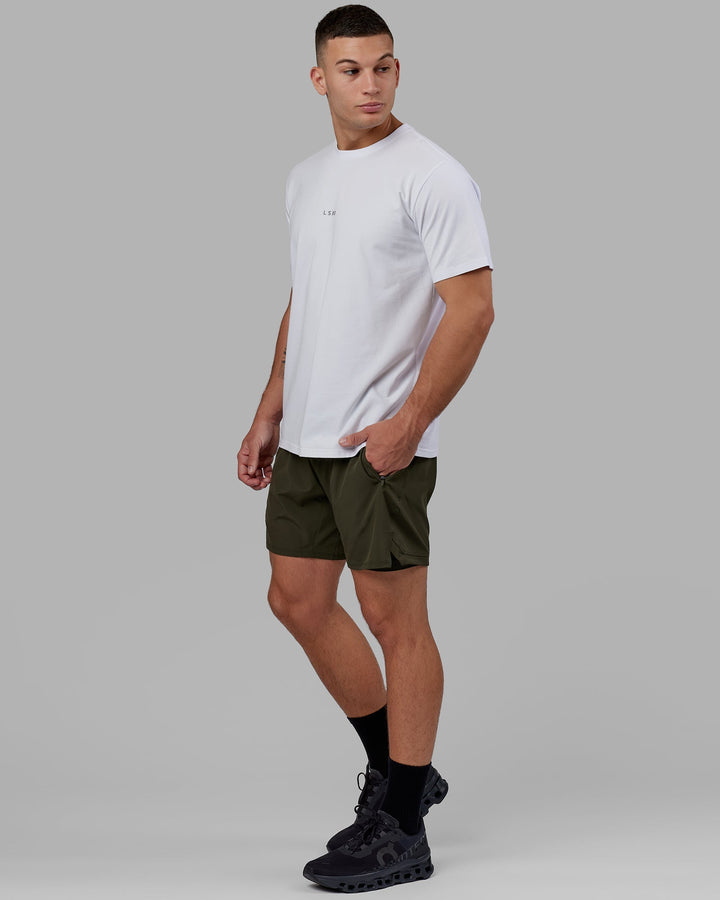 Man wearing Challenger 6" Lined Performance Short - Forest Night