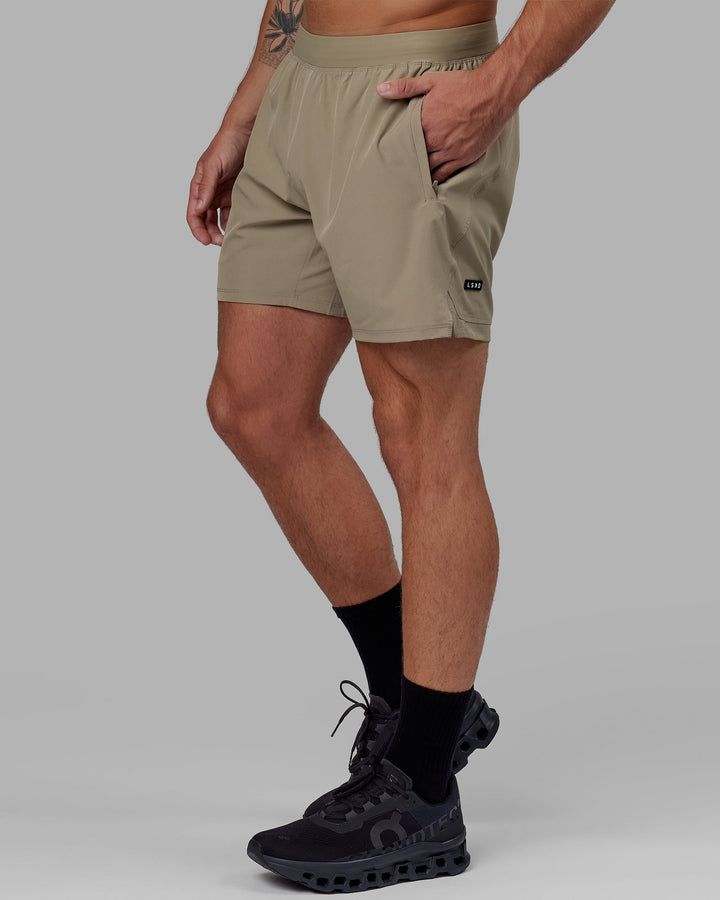 Man wearing Challenger 6" Lined Performance Short - Laurel Oak