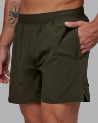 Man wearing Challenger 6" Performance Short - Forest Night